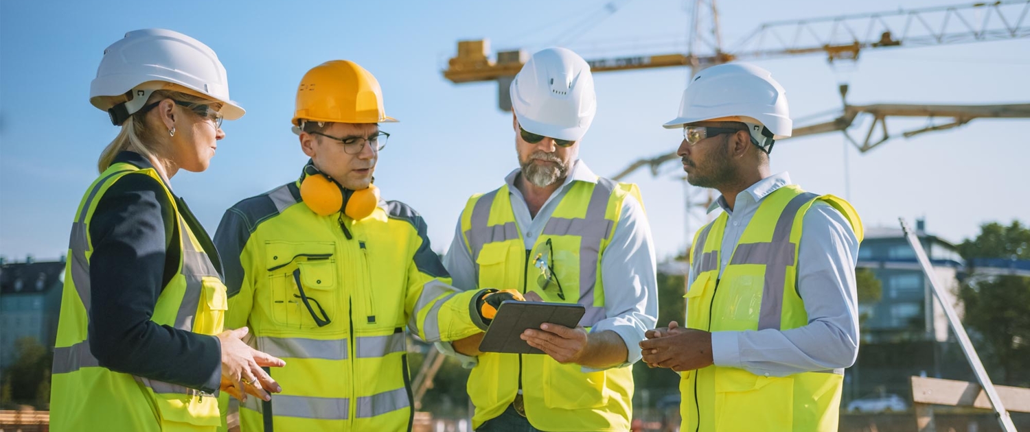 Front view of four construction workers